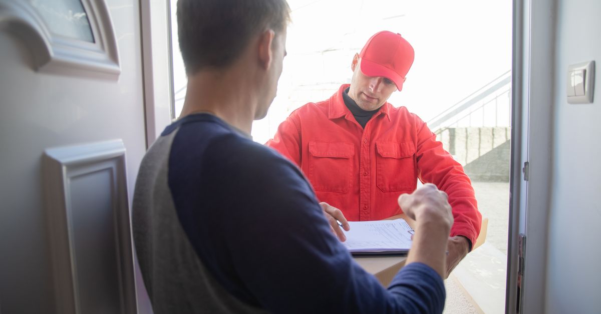 locksmith unlocking front door — Mill Station Locksmith Corp